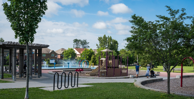 byer's pond park with splash pad, walking path, playset